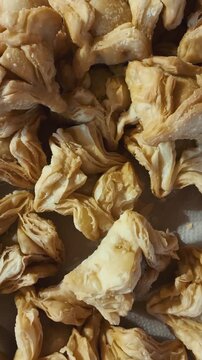 Close up of traditional Argentine pastelitos criollos, sweet flaky pastry desserts stacked together, Classic Popular Food