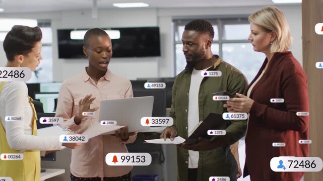 Lead opening laptop and gesturing, marketing team reviewing campaign results while likes overlaying