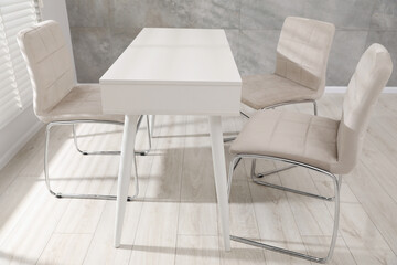 Obraz premium Group of stylish chairs and desk in office