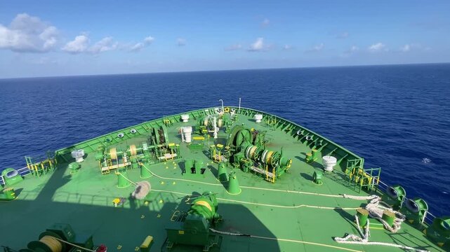 LPG gas and oil tanker ships anchored in the ocean, with a fast patrol boat in the foreground. Global energy transport, war energy crisis, and Strait of Hormuz blockade concept.