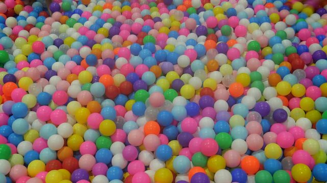 Children playing in ball pool