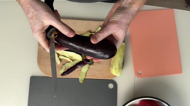 Topdown View Slicing Plantain Into Cubes On Wooden Board, Steady Knife Work, Neat Piles Into Bowl, Countertop