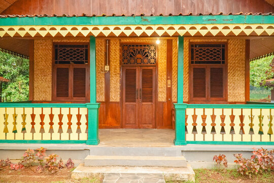 Traditional Betawi house facade with colorful wooden architecture representing Jakarta cultural heritage and local tradition.