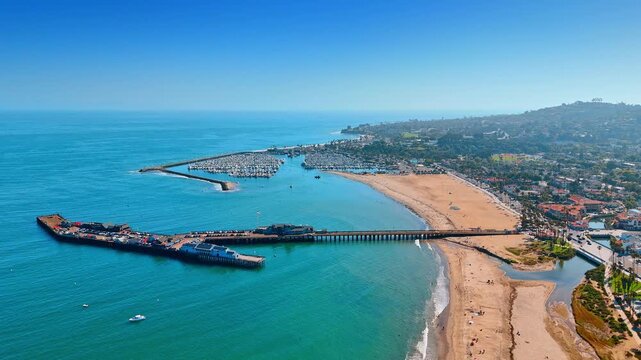 Historic Stearns Wharf in Santa Barbara, California, USA. Aerial view on the oldest working wharf on the California coast. Yacht club in the backdrop.