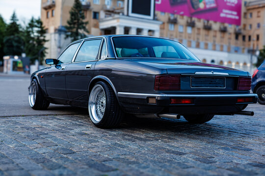 Kharkiv, Ukraine, 05.20.2026, Editorial photo of a classic British Jaguar XJ (XJ40) luxury sedan at a night car meet.