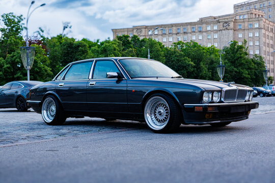 Kharkiv, Ukraine, 05.20.2026, Editorial photo of a classic British Jaguar XJ (XJ40) luxury sedan at a night car meet.