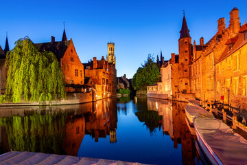 Fototapeta premium Brugge medieval architecture along Rozenhoedkaai canal at night, Belgium