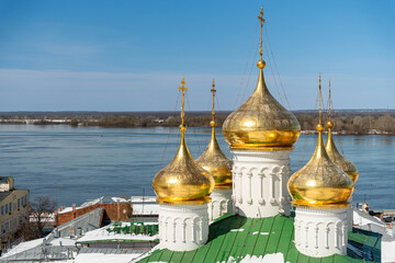 Golden Onion Domes Overlook Icy River, Snowdusted Rooftop With Green Metal Tiles, Gilded Crosses Glinting In Clear Blue Sky, Tranquil Winter Morning, © Egor Lint
