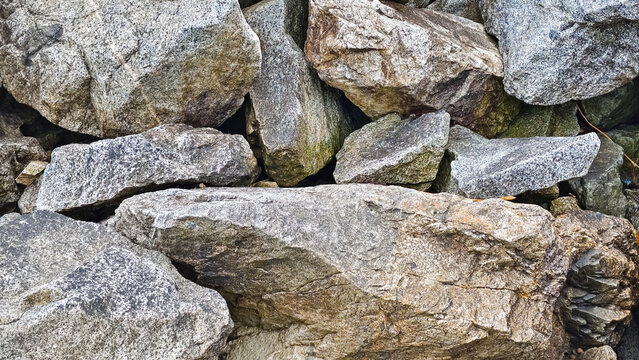 Pile of textured rocks and stones close up