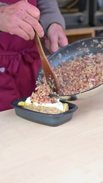 Close Up Chef Preparing Tiroler R&ouml;sti at Austrian Christmas Market Stall