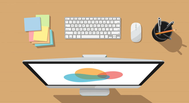 Top view of a modern computer setup with keyboard mouse monitor and sticky notes on a wooden desk