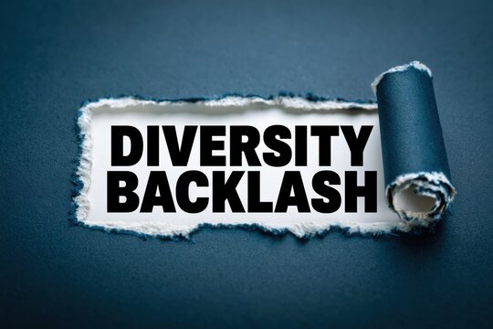 Diversity Backlash a social issue revealed under torn blue paper