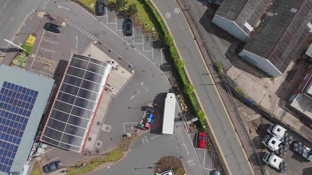 Truck Reversing Into Industrial Loading Area From Above