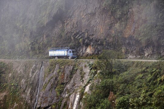 Trucks on Death Road, Camino de la Muerte, Yungas North Road between La Paz and Coroico, Bolivia
