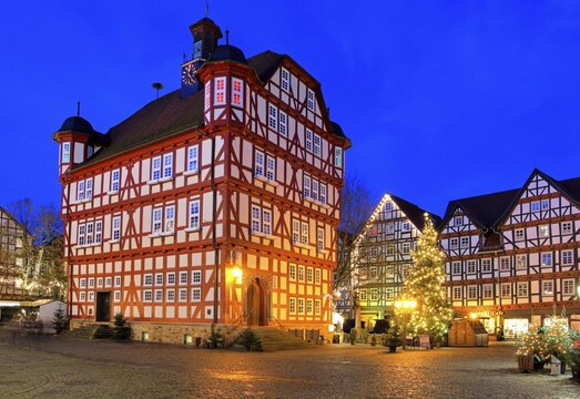 Town Hall Square, Rathausplatz with half-timbered houses and town hall at Christmas lighting, dusk, Melsungen, Hesse, Germany