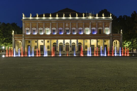 Illuminated fountain at the theater, Teatro Municipale also Teatro Municipale Valli, dusk, Reggio Emilia, Emilia-Romagna, Italy