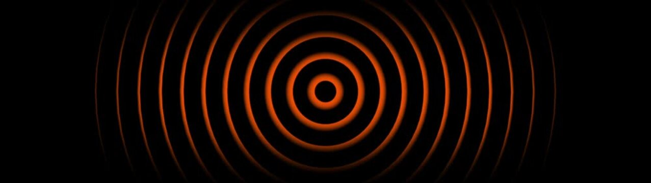 Abstract orange concentric circles pulsing animation on black background, seamless motion loop for technology and science presentations