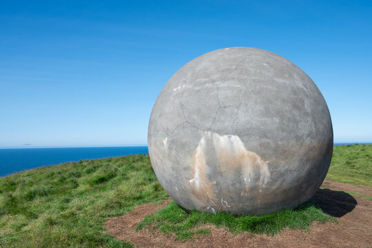 round stone marking the arctic circle on island of Grimsey in Iceland