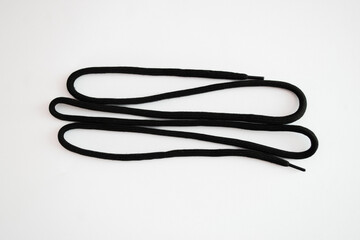 Naklejka premium black shoelaces on a white background
