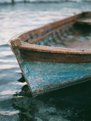 Fototapeta premium Wooden boat harbor dusk weathered hull moored closeup