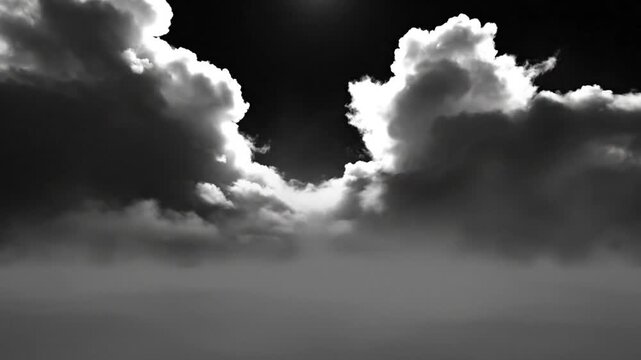 Dramatic monochrome view of cloud formations with light filtering through a gap, creating an ethereal and atmospheric scene