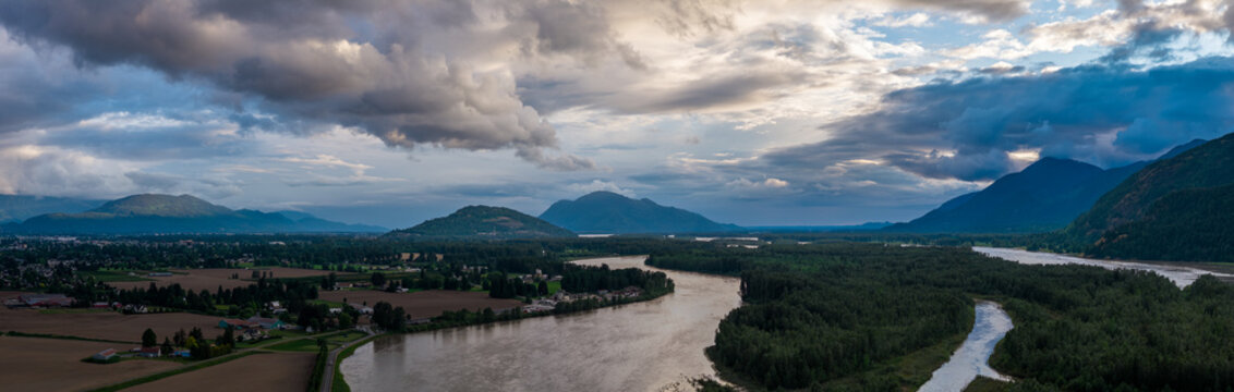 Dramatic Aerial Panorama of Chilliwack River Valley with Mountains and Storm Clouds in British Columbia