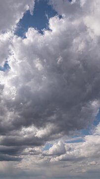 Dynamic Cloud Formation in Blue Sky Vertical Timelapse Weather Concept