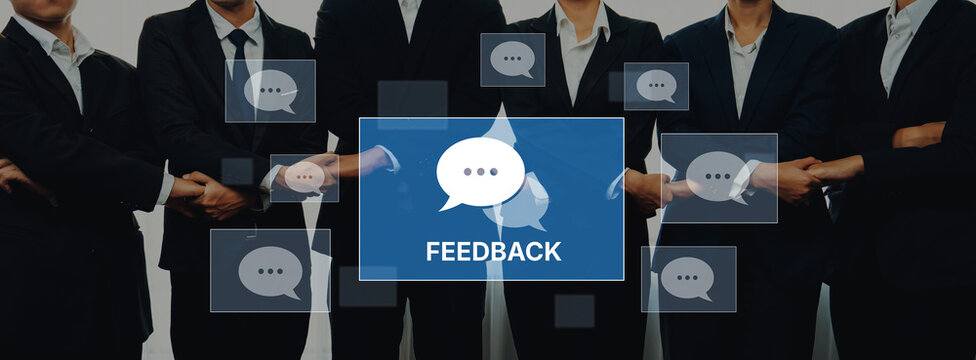 A group of business professionals standing together in suits, emphasizing the importance of teamwork and feedback, with speech bubbles showcasing effective communication. Trope