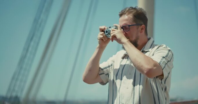 Man Shooting Photos on Cruise Ship Deck with Ocean Views