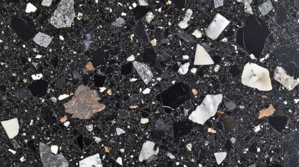 Fototapeta premium Top-down photograph of modern charcoal black terrazzo stone texture, premium architectural flooring material pattern