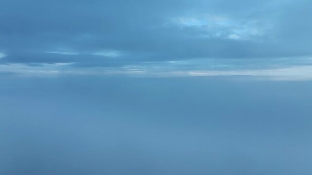 Vast blue sky background covered with layers of clouds and atmospheric depth