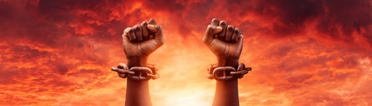 Juneteenth freedom fist raised hand chain broken slavery abolition sunset sky