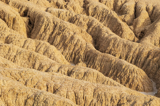 View of the unique eroded clay formations and deep ridges of the Bardenas Reales semi-desert landscape in Navarre, Navarre, Spain.