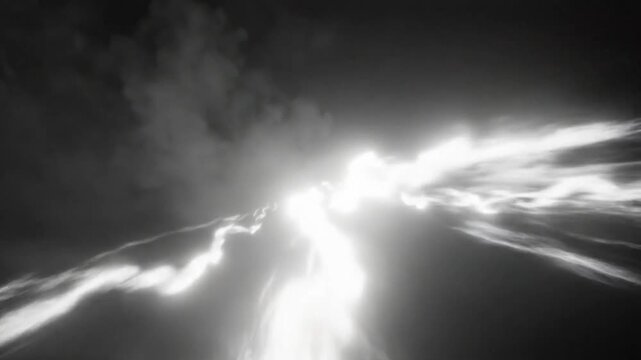 Dramatic and awe-inspiring lightning strikes with bright flashes and dark cloudy background in black and white cinematography