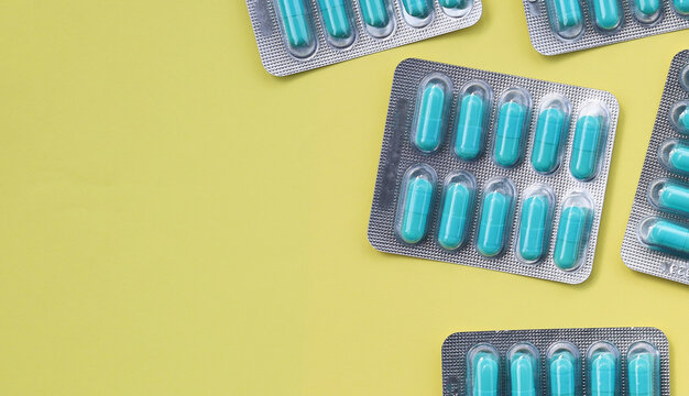 Blue capsules of Doxycycline in blister packs.