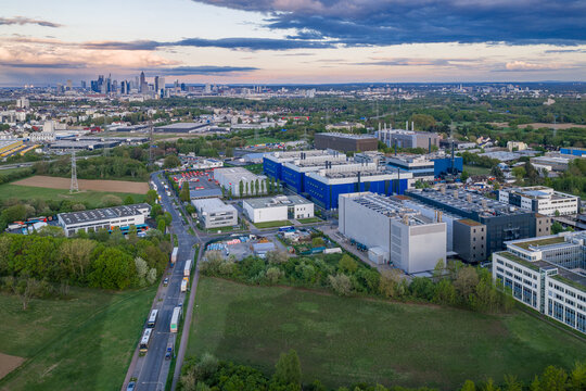 Aerial view of the Digital Realty Frankfurt FRA30 data center complex with the city skyline in the background under a sunset sky in Frankfurt am Main, Hessen, Germany.