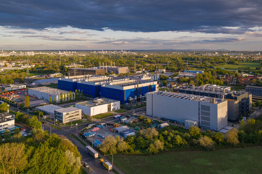Aerial view of Digital Realty Frankfurt FRA30 data center complex with modern industrial buildings and surrounding green landscape Frankfurt am Main, Hessen, Germany.