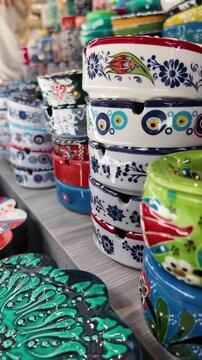 Colorful pottery displayed in a market stall in Mexico
