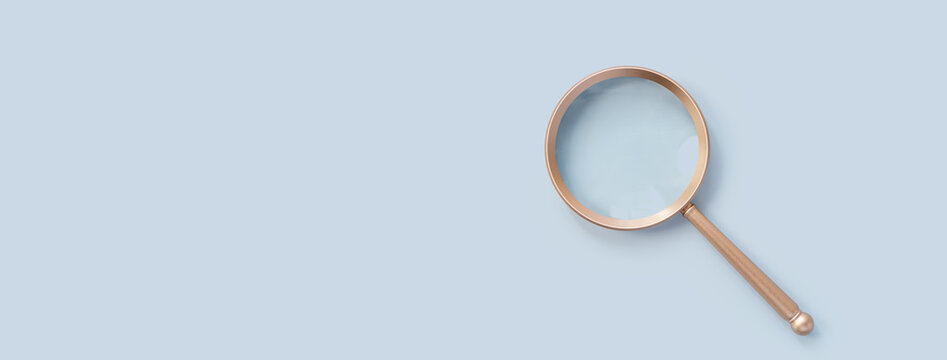 Champagne Gold Magnifying glass isolated on pastel blue background with copy space, represents searching for content about beauty and feminine, minimal top view, modern scene, luxury soft light shadow