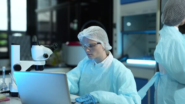 Lab work, scientists holds a test tube takes the test from a test tube in analysis for vaccine development.