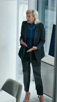 Presentation, digital or woman in agency with screen, software demo or innovation review in meeting. Speaker, person or mature manager at tech, enterprise solution or brief on transformation strategy