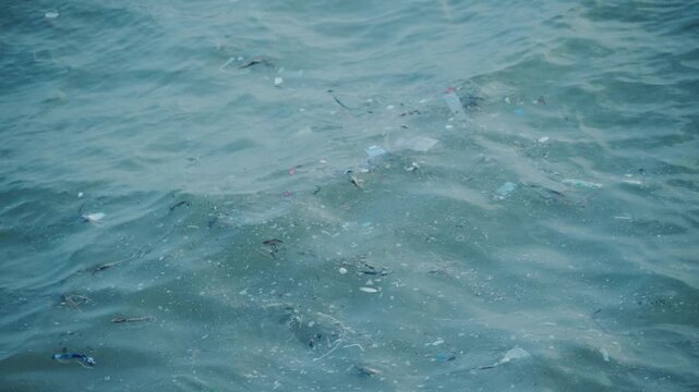 Plastic waste and household garbage floating on the sea surface, ocean pollution concept.,The world's most polluted beach, Plastic marine debris.