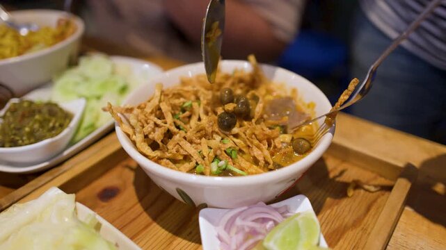 Northern Thai Khao Soi Curry Noodles Served with Crispy Toppings