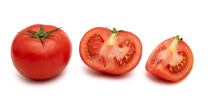 Whole tomato with half and a quarter slice isolated on white background