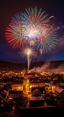 Naklejka premium Stunning colorful fireworks display over a traditional European town at night.