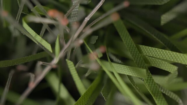 Fake fiber optic Christmas tree pine leaves close up rotating motion stock footage