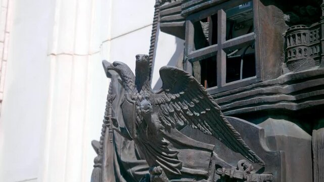 Detailed eagle statue showcases impressive craftsmanship and powerful symbolism. A majestic sculpture captures the bird's strength and grace.