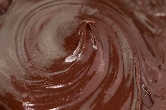Close up melted dark chocolate background and texture.