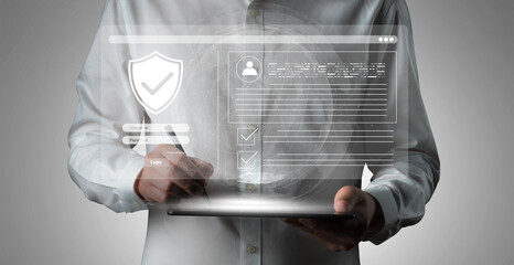 A man stands holding a tablet, engaging with a floating virtual interface that represents digital security and data privacy in the modern workplace. Cyphers © InfiniteFlow