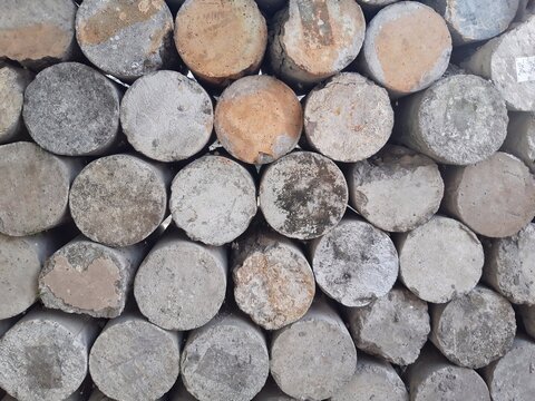 Stacked concrete cylinders texture, construction material background